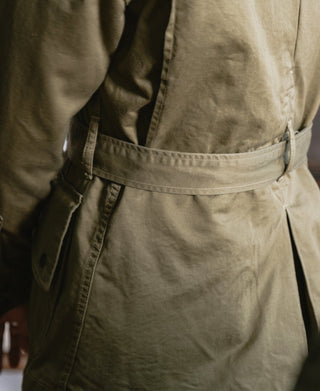 Khaki green paratrooper jacket with snap pocket flaps and belted waist