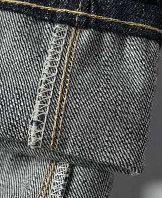 Selvedge denim jeans close-up with contrast stitching and stitched pocket edge