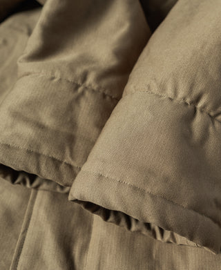 Khaki deck jacket hem with ribbed cuff and textured lining edge