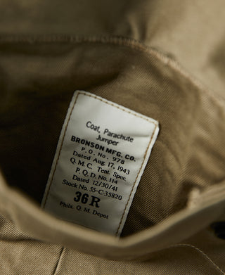 Paratrooper jacket inner label on khaki lining with stitched fabric details