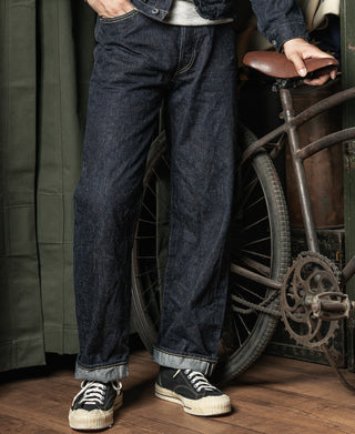 Indigo selvedge denim jeans on model, straight leg silhouette, button fly