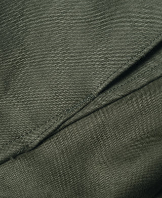 US Army M-65 field jacket, olive textured canvas fabric with curved seam stitching
