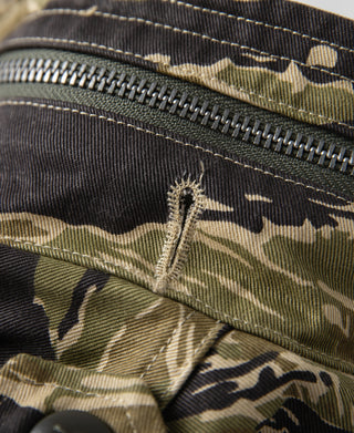 Tiger stripe camo field jacket zipper and stitched pocket detail