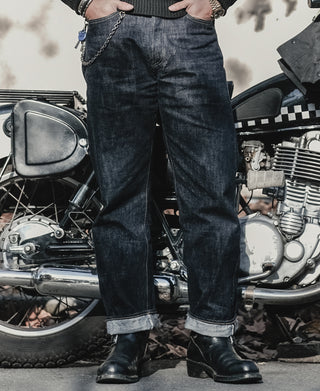 Indigo denim jeans with straight-leg fit, cuffed hem, and visible seam stitching
