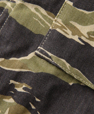 Tiger stripe camo field jacket: pocket flap seam detail in olive and dark