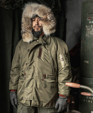 Olive Type N-3 parka on model with fur hood trim and chest pockets