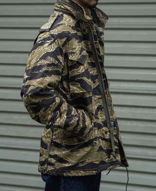 Tiger stripe camo field jacket with full sleeves and front zipper, side profile