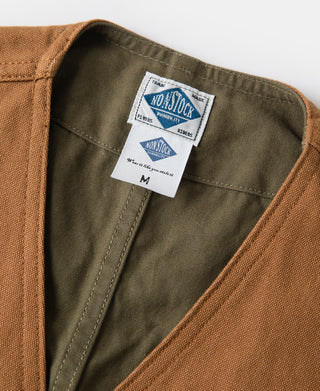 Canvas vest neckline with green lining and interior brand size tag