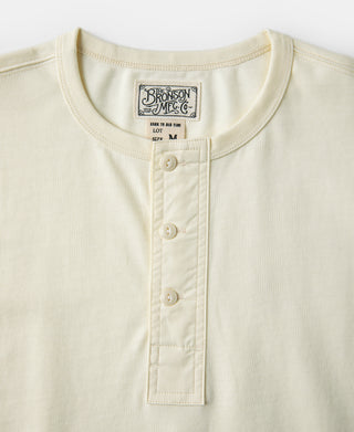 Cream henley T-shirt neckline with short button placket and tag detail