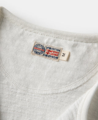 White henley t-shirt with ribbed crew neck and interior brand tag