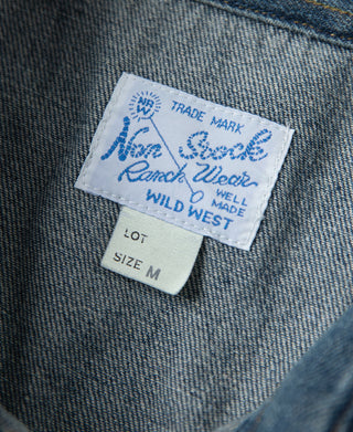 Inside neck label on blue denim western shirt, size M
