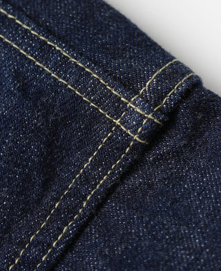 Indigo denim jacket sleeve seam with contrast yellow topstitching