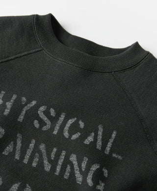 Vintage black raglan sweater close-up of crew neck and faded “Physical Training” print