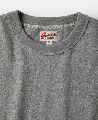 Gray heather crew-neck t-shirt with red brand label on the inside collar