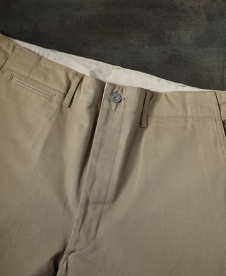 Tan chino trousers with front button closure and belt loops