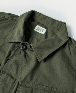 Olive fatigue jacket collar with button placket and interior label