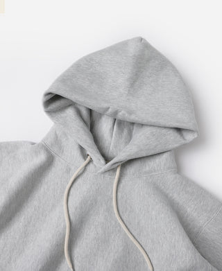 Gray hoodie hood with cream drawcords and metal tips