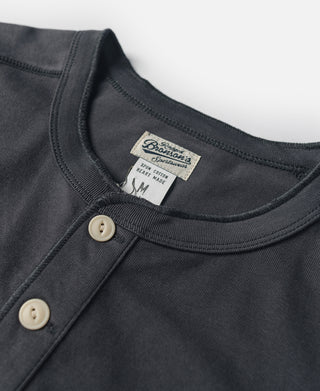 Dark gray henley neckline with button placket and ribbed crew collar