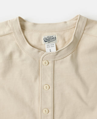 Apricot cotton short-sleeve henley T-shirt with three-button placket, ribbed neckline
