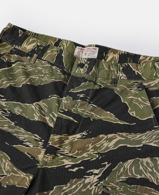 Tiger stripe camo fatigue pants featuring a button fly and front patch pockets.