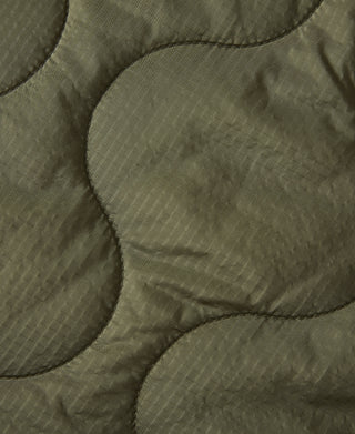 Olive quilted padded jacket fabric with raised pattern stitching detail