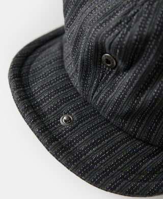 Black and gray striped newsboy cap with side button and curved brim.