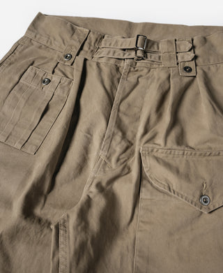 Khaki bermuda shorts close-up of side pockets, button tabs, and belt loops