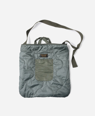 Olive canvas tote bag with front patch pocket and shoulder strap