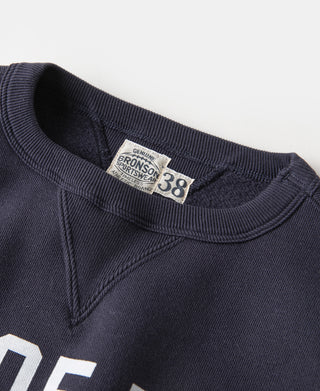 Navy sweater neckline with V-inset seam and ribbed crew collar
