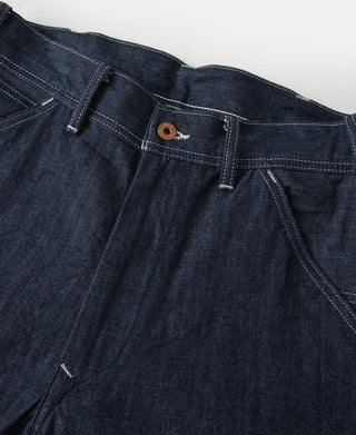 Indigo denim painter pants waistband with brown button and belt loops