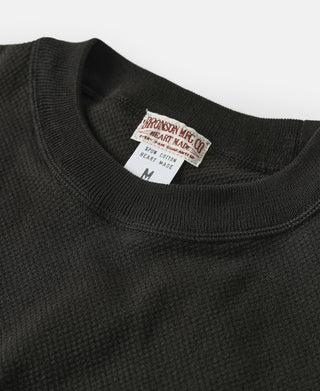 Black crew-neck waffle-knit t-shirt with brand tag at neckline