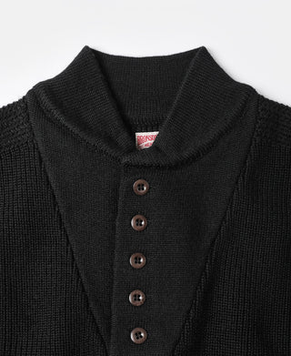 Black wool high-neck sweater close-up: button placket and BROOKS label