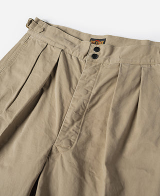 Khaki combat pants waistband with button closure and pleated front