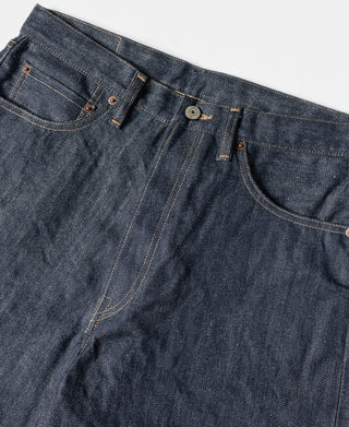Dark blue denim jeans waistband with button-fly and coin pocket stitching