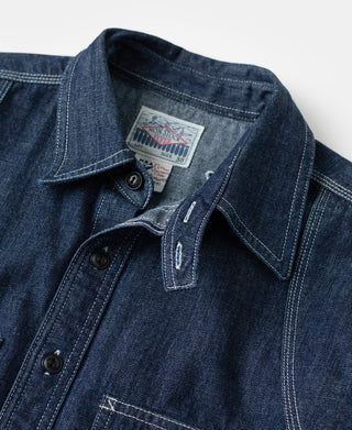 Indigo denim work shirt collar and button placket with interior brand label