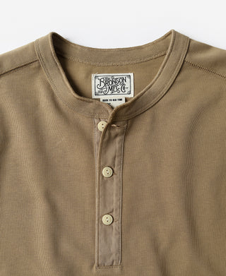 Khaki henley neckline with three-button placket and stitched collar