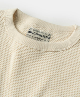 Thermal waffle-knit shirt neckline with ribbed crew collar in light apricot/cream