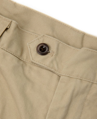 Khaki chino trousers close-up of front button and waistband seam
