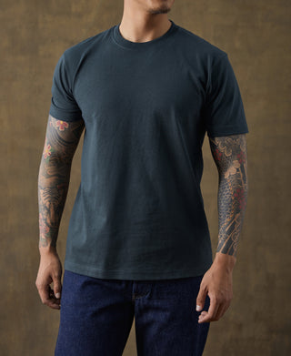 Dark vintage cotton T-shirt with crew neck and short sleeves, worn by model