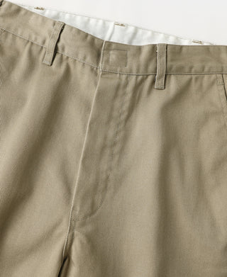 Close-up of khaki work pants waistband and front seam detail