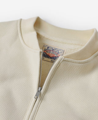 Apricot half-zip fleece sweatshirt collar label under the zipper placket