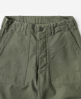 Olive utility fatigue pants close-up, waistband with belt loops and center button