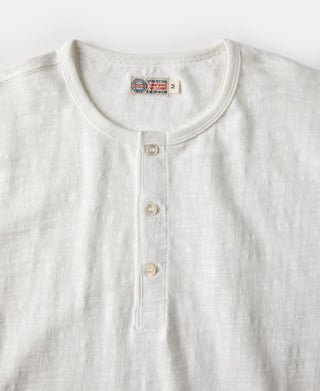 White henley t-shirt with button-front placket and round metal buttons