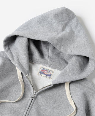 Gray terry cloth hoodie hood and front zipper detail with stitched hood label