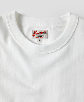 White crew-neck athletic T-shirt with visible inner size label at neckline