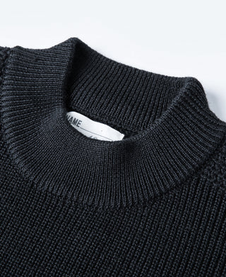 Navy crewneck sweater neckline with woven interior brand label