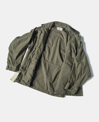 Olive M-1951 field jacket with interior lining and snap front placket details