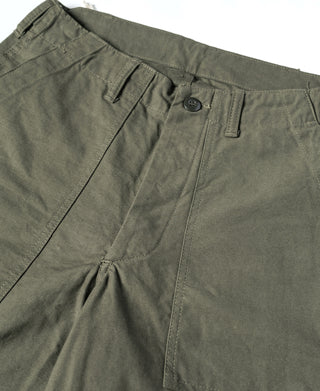 Olive fatigue utility shorts showing waistband tabs and front pleats with button