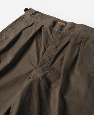 Dark brown combat pants waistband with button fly, pleats, and belt loops