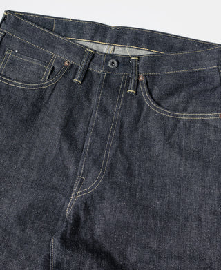 Indigo denim jeans close-up of waistband, belt loops, and button fly